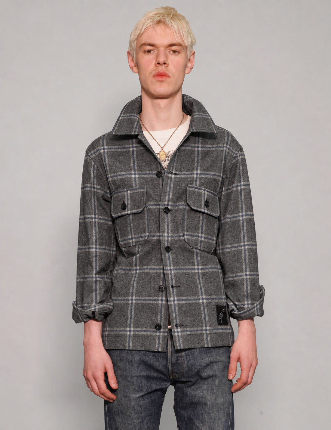 STUART TREVOR charcoal windowpane workshirt buttoned up, showing black buttons and two chest pockets.