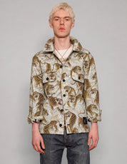 STUART TREVOR ivory and gold tiger workshirt buttoned up, showing two chest pockets.