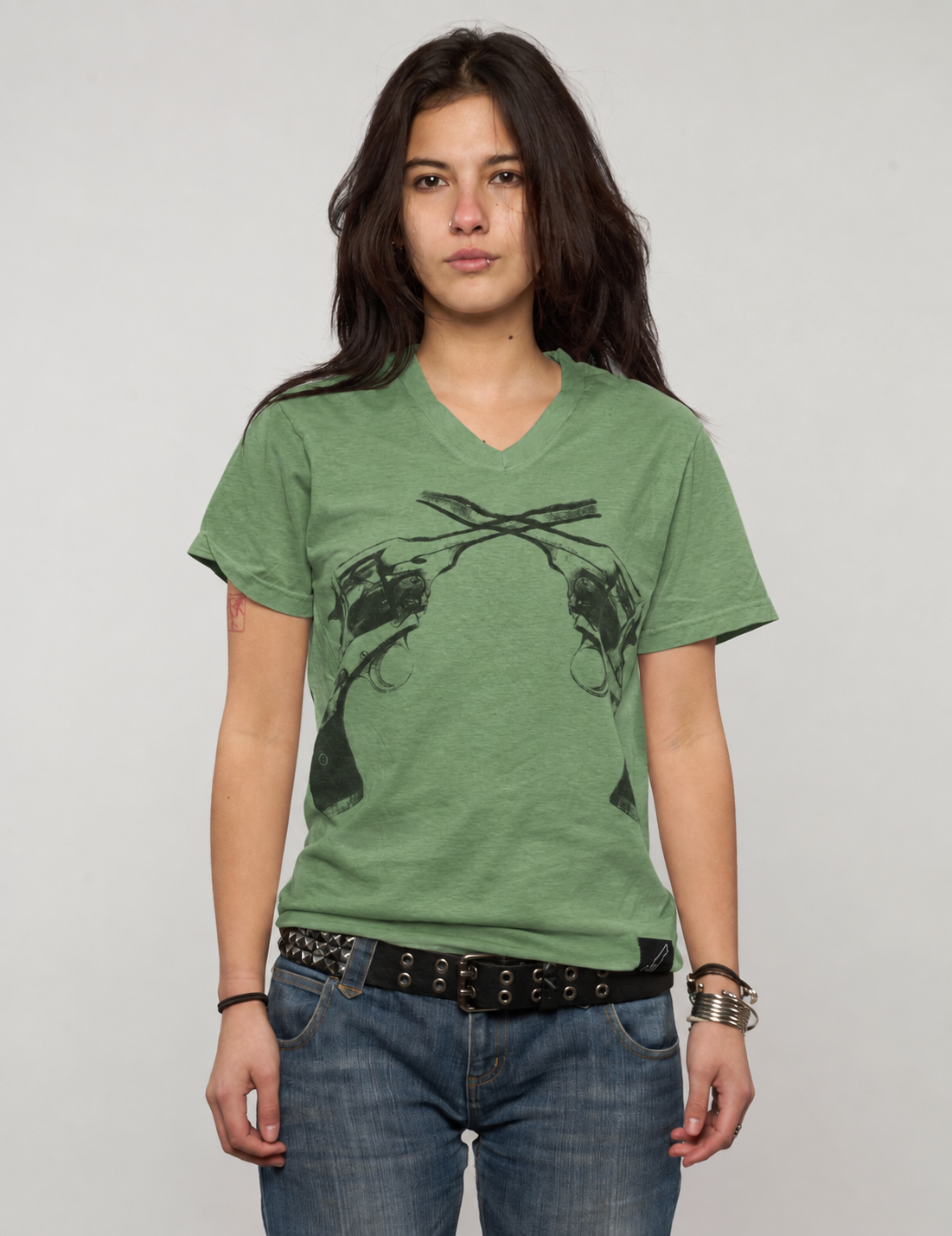 Green Crossed Pistols tee worn by a woman, front detail