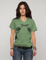 Green Crossed Pistols tee worn by a woman, front detail