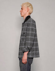 Side view of STUART TREVOR charcoal windowpane workshirt with turned-up collar.
