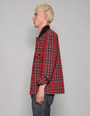 Side view of STUART TREVOR red tartan cotton workshirt with turned-up collar.