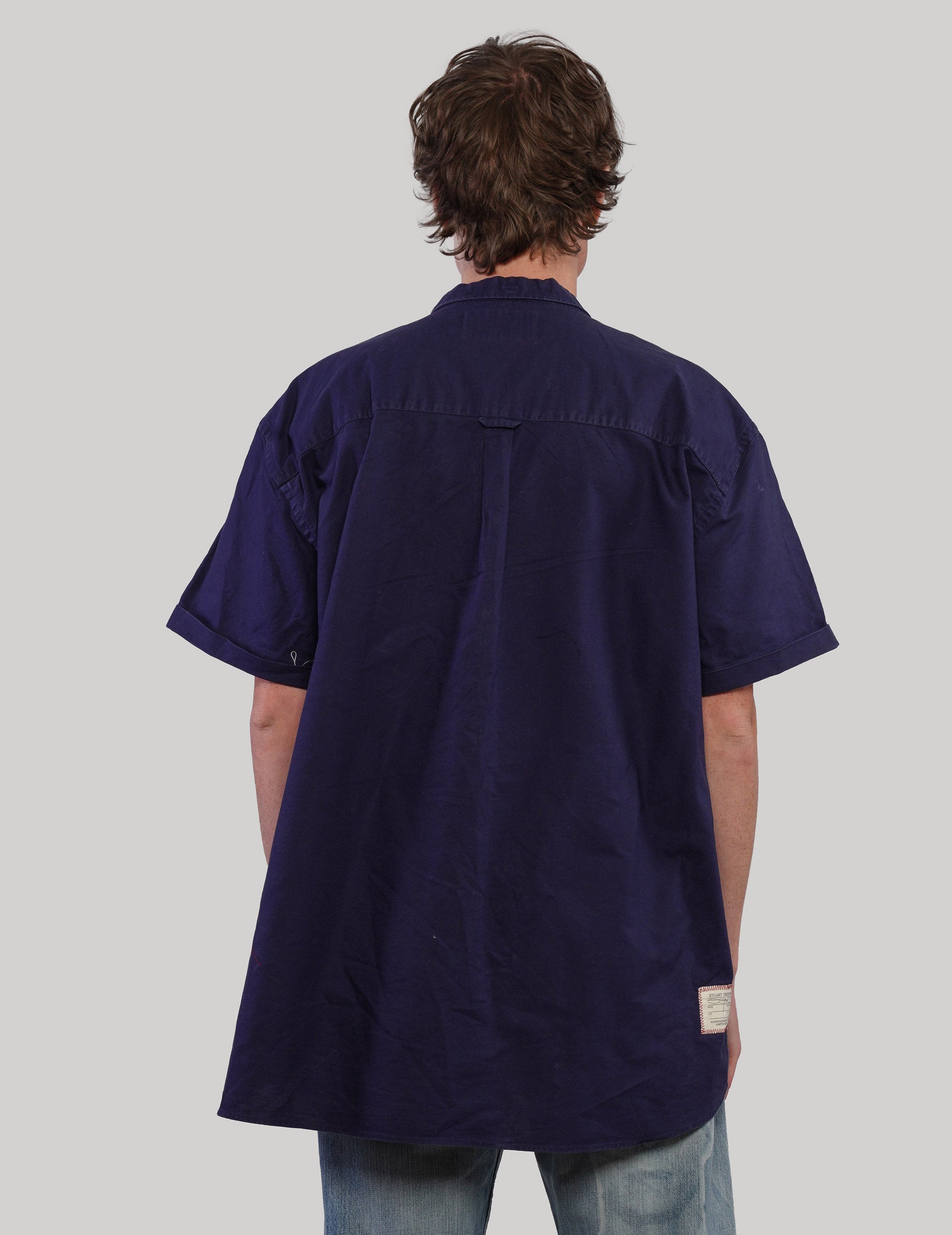 Navy shirt with light Love Will Tear Us Apart wording, straight front view
