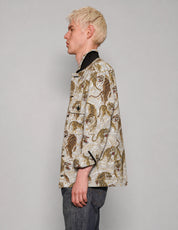 Side view of STUART TREVOR tiger workshirt with turned-up collar.