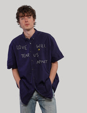 Navy short-sleeve Love Will Tear Us Apart shirt, side view