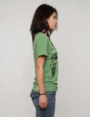 Green Crossed Pistols tee flat lay showing crossed pistols graphic