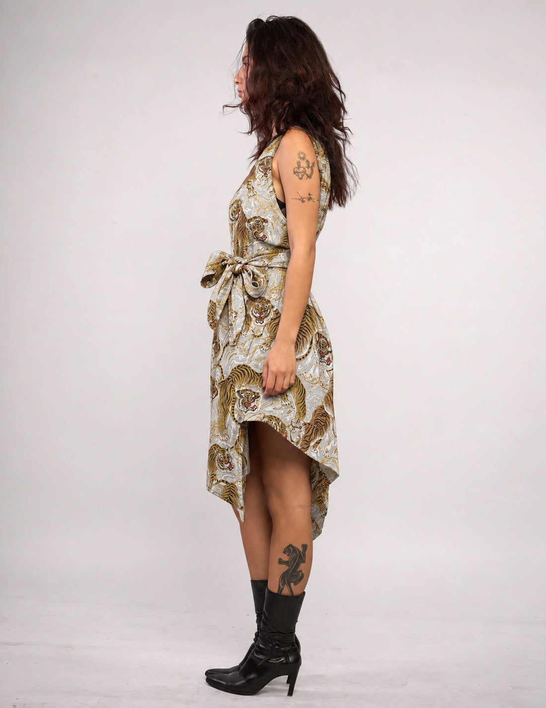STUART TREVOR ivory tiger-print Pirate Dress – left side view with matching fabric belt tied at waist.