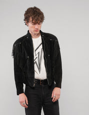 Front view of the black studded fringed zip jacket worn open.