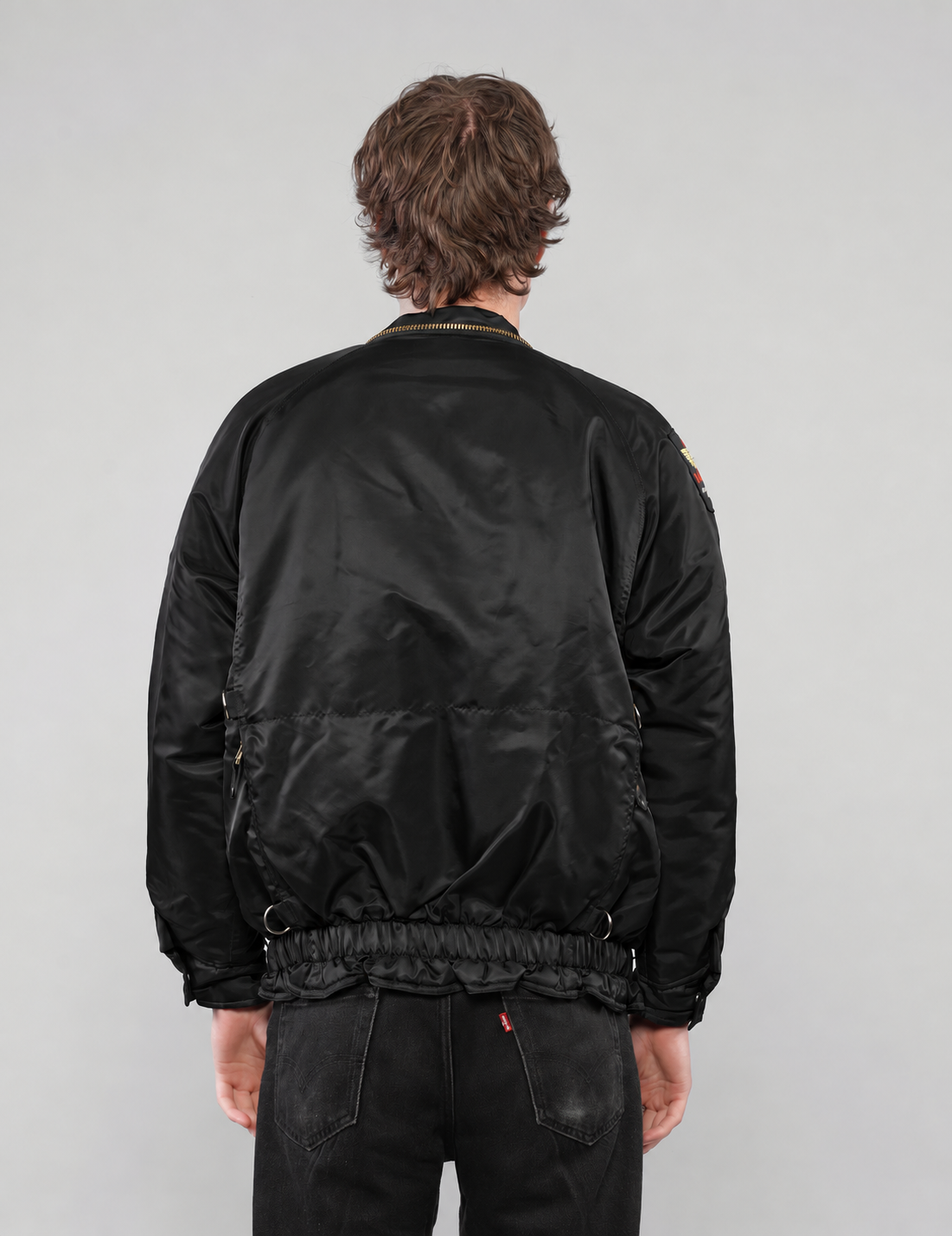 Black clasp-front jacket, side view without hood
