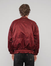 Back view of a burgundy clasp-front jacket without the hood.