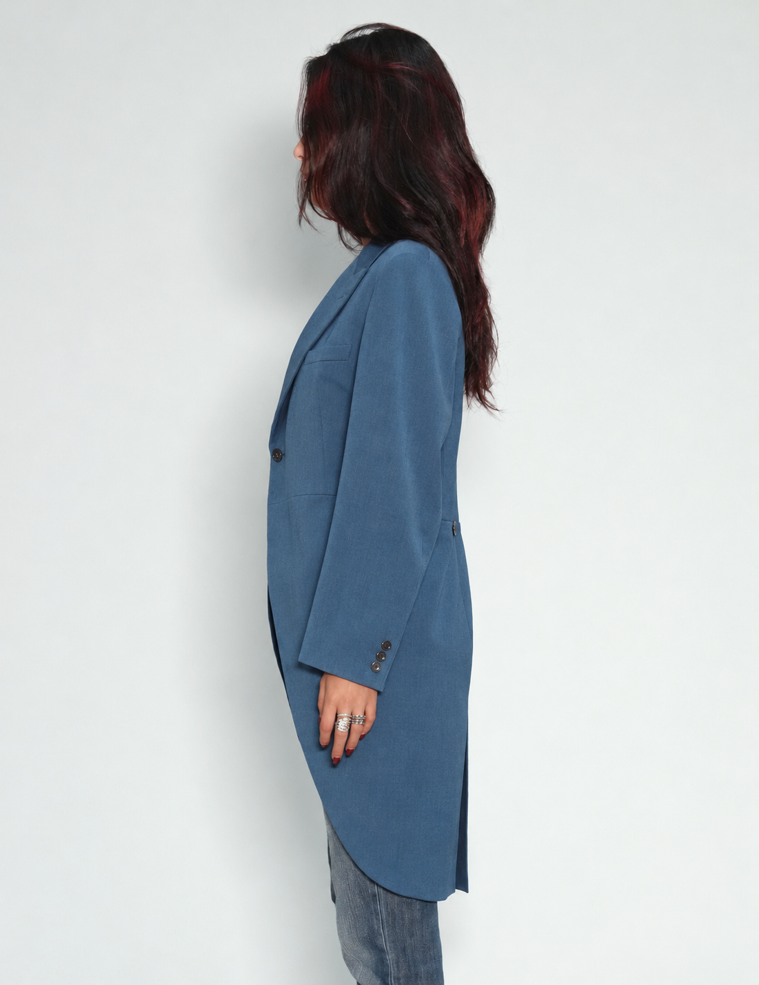 Blue Edwardian tailcoat on model, angled front view