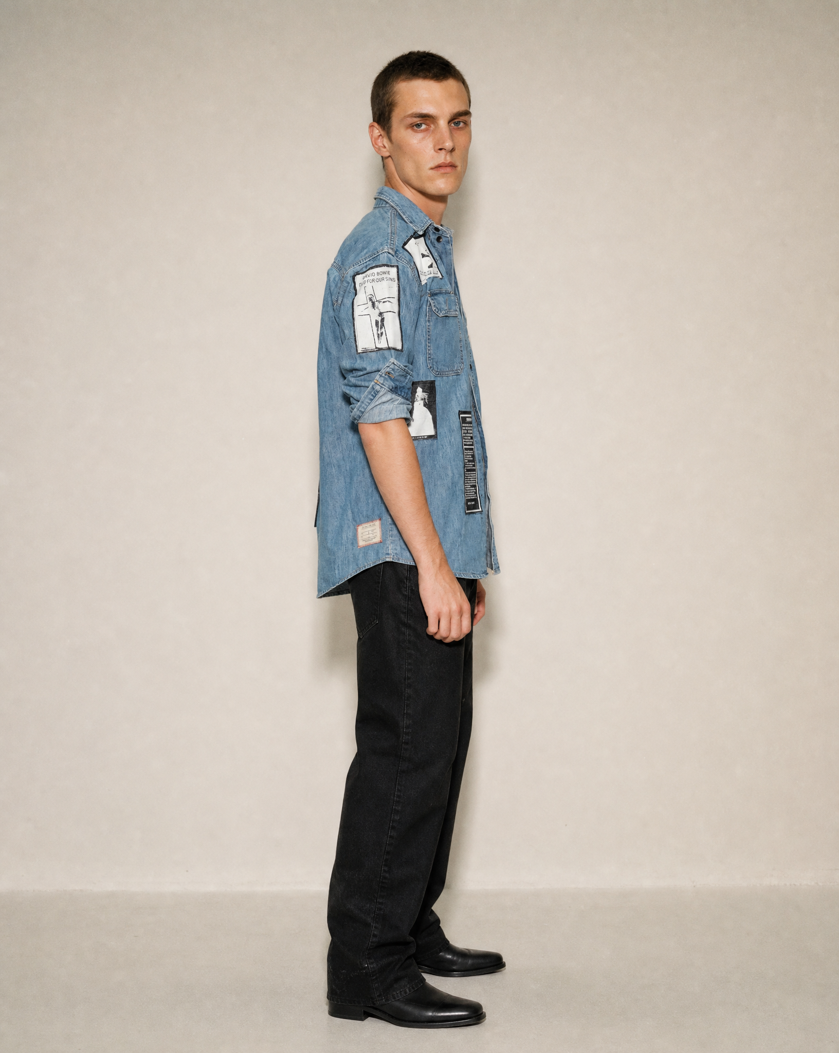 Side view of the patched denim shirt showing the sleeve and body