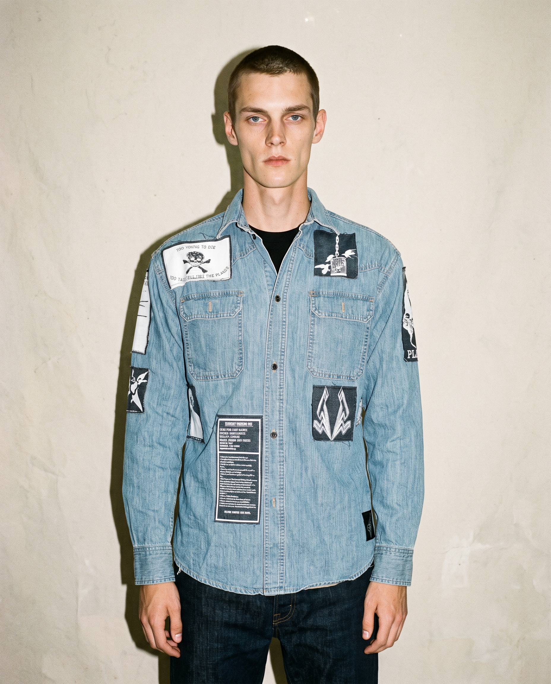Light blue patched denim shirt worn front-on