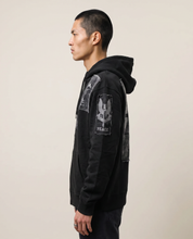 Side view turned to the left, showing the sleeve and drawstring hood
