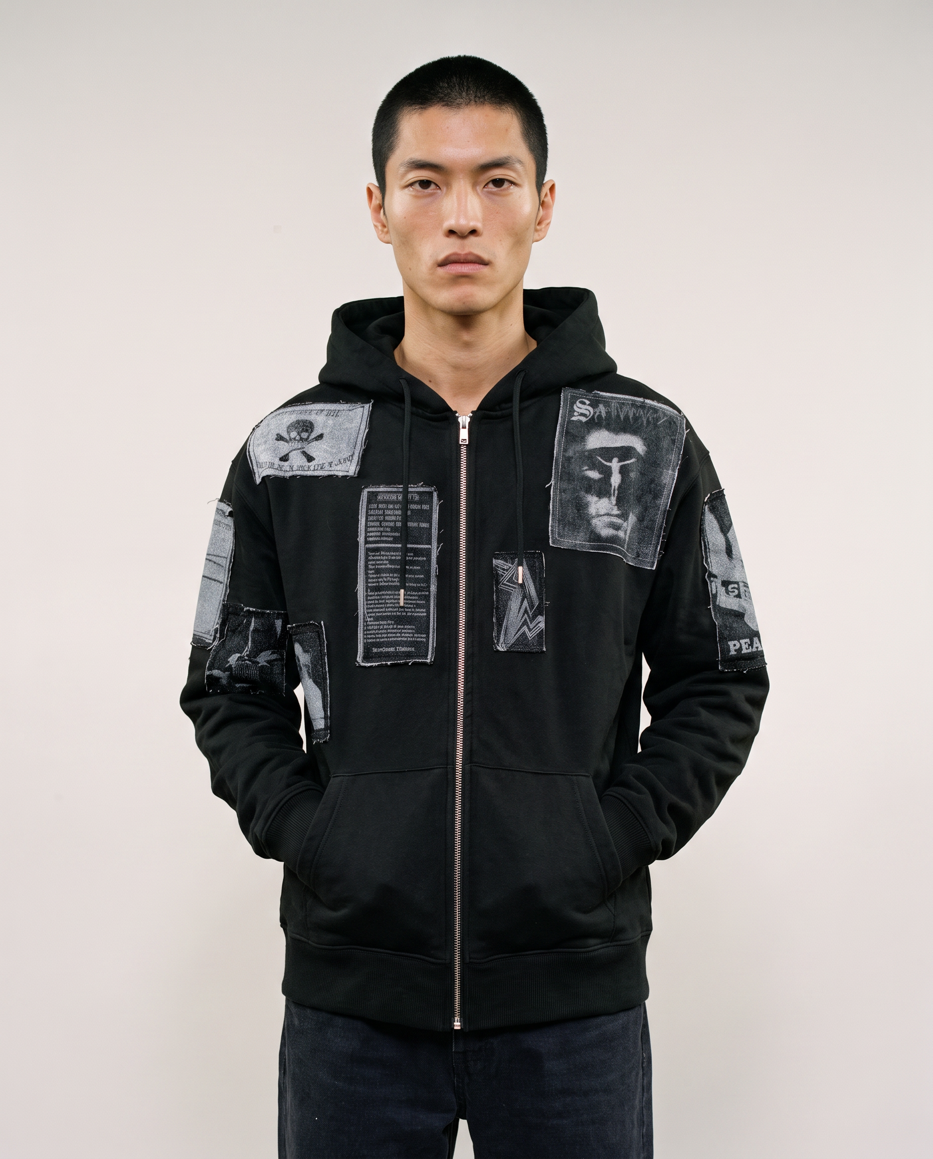 Black zip hoodie worn zipped up, front view with the hood down