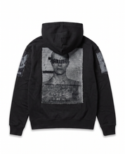 Back view of the black No Prisoners zip hoodie, showing the mugshot screen print