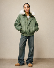 Green hooded flying jacket worn open, studio shot on a plain background