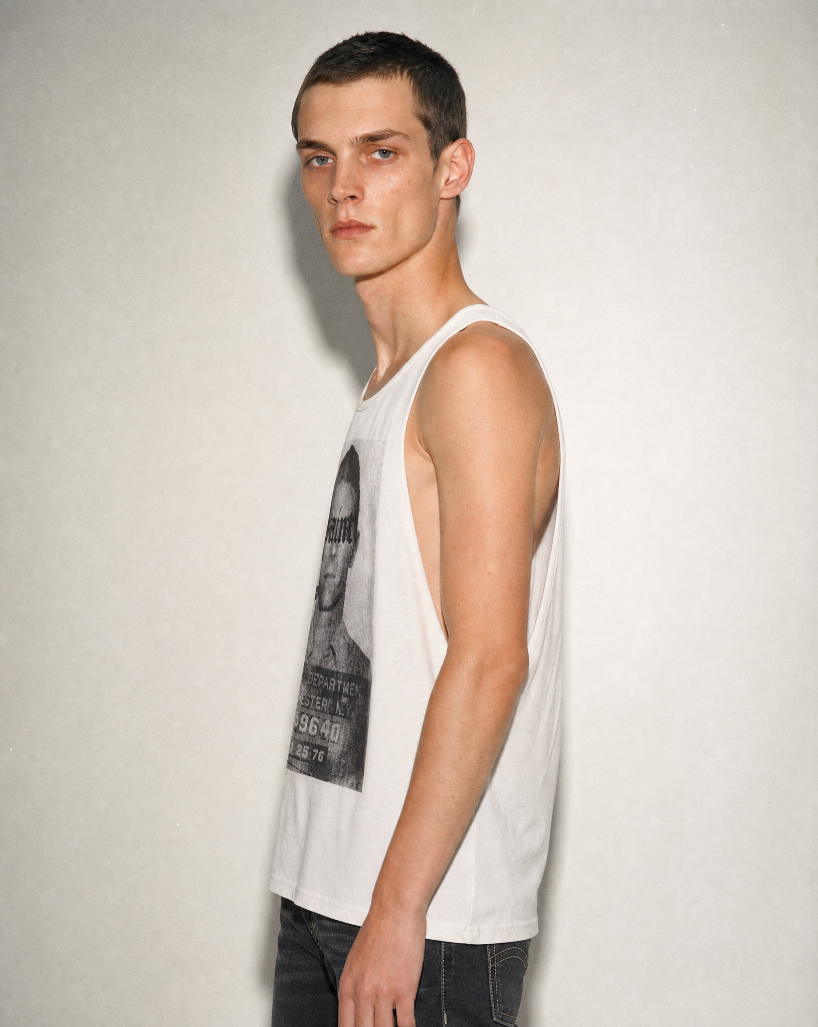 Ecru Saint vest from the side, showing the shoulder and neckline