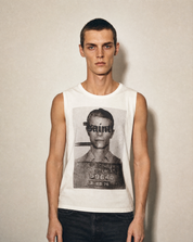 Ecru Saint vest worn front-on, mugshot screen print across the chest