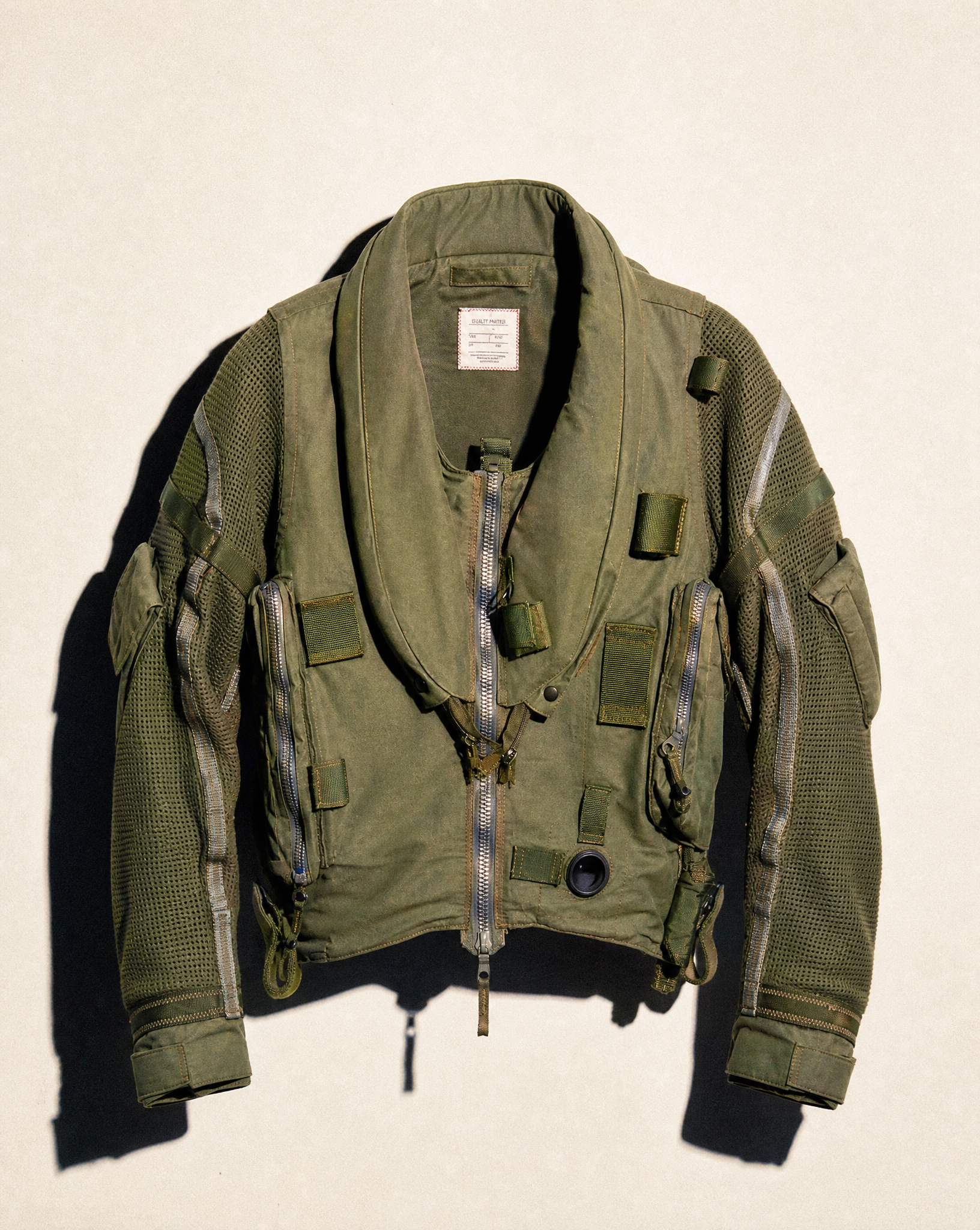 Khaki RAF Hurricane flight jacket on a plain background, front view with zip and side pouches