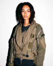 Vintage khaki RAF flight jacket worn open, showing the oversized fit