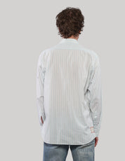 Back view of a white pinstripe shirt showing fine vertical stripes, long sleeves and a curved hem.