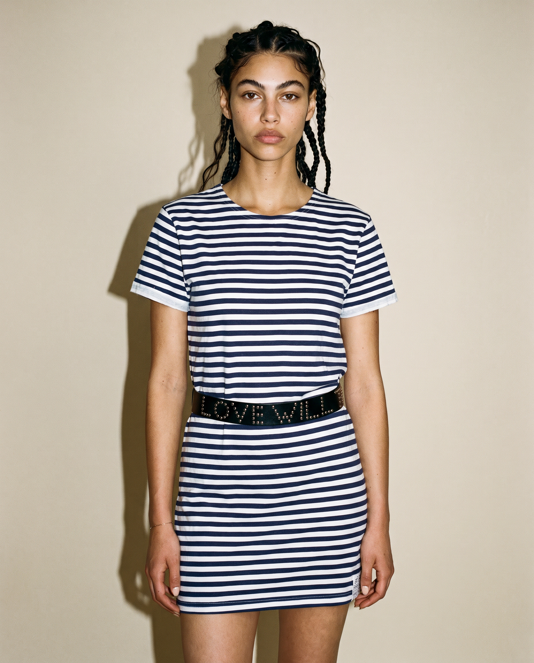 Breton stripe t-shirt dress worn with a studded belt, front view