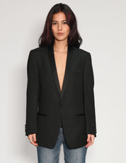 Black Party Back tuxedo jacket worn open, front view, with blue jeans