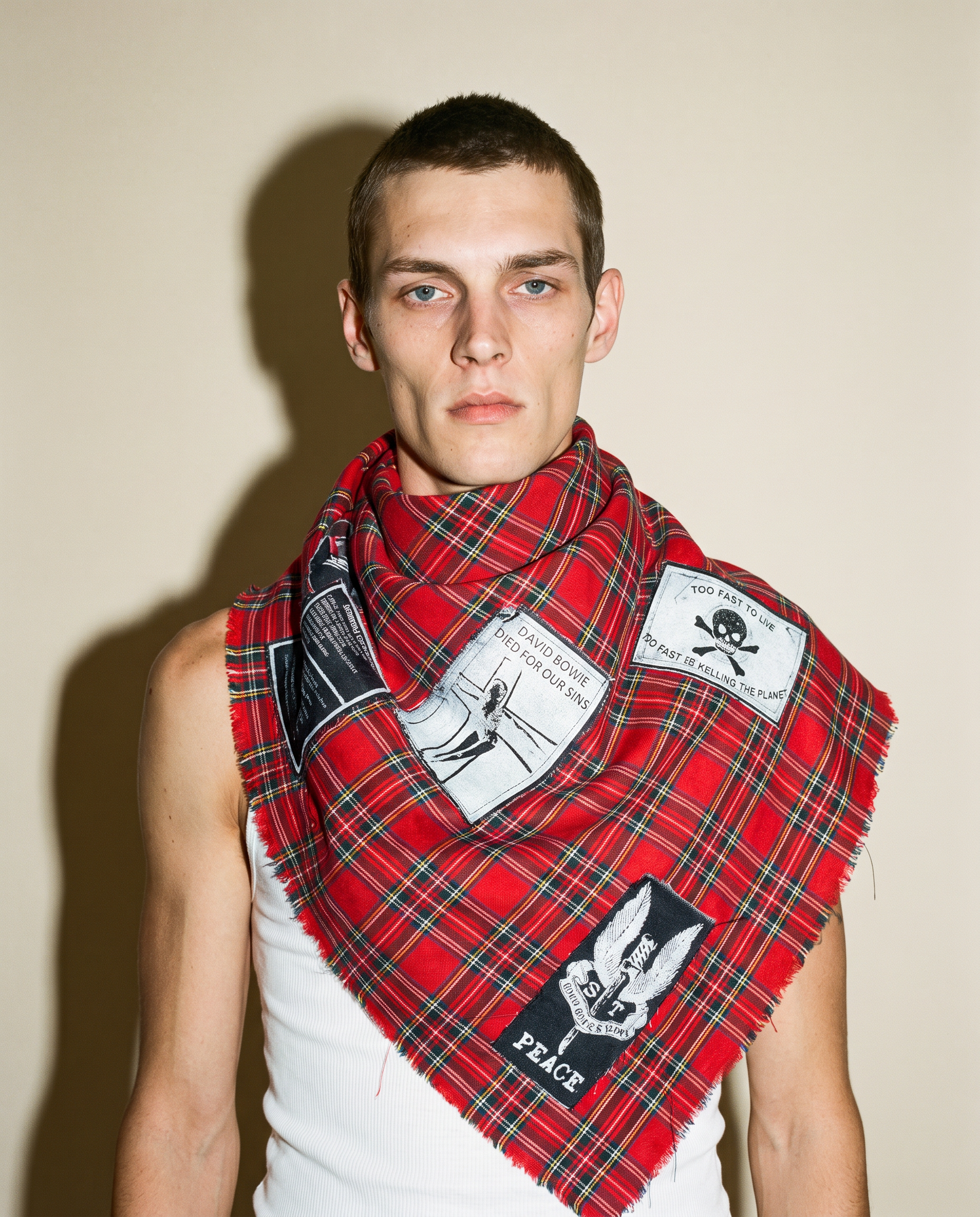 Red tartan Highland Riot patched scarf worn draped, studio shot