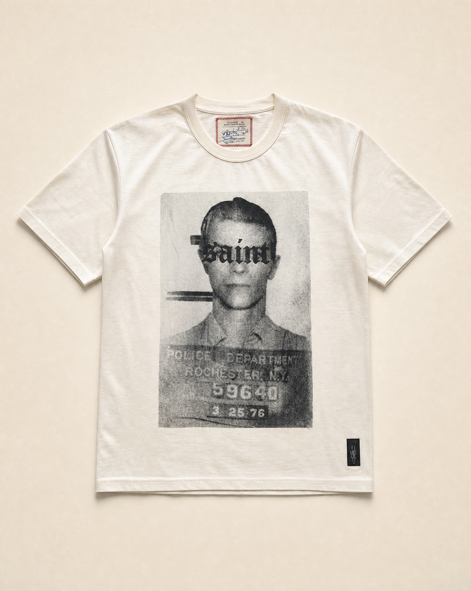 Ecru Saint t-shirt on a plain background, front view