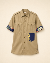Front view of the olive green military shirt with tropical print contrast panels