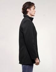 Side profile of model wearing a black wool-blend naval peacoat with long sleeves.